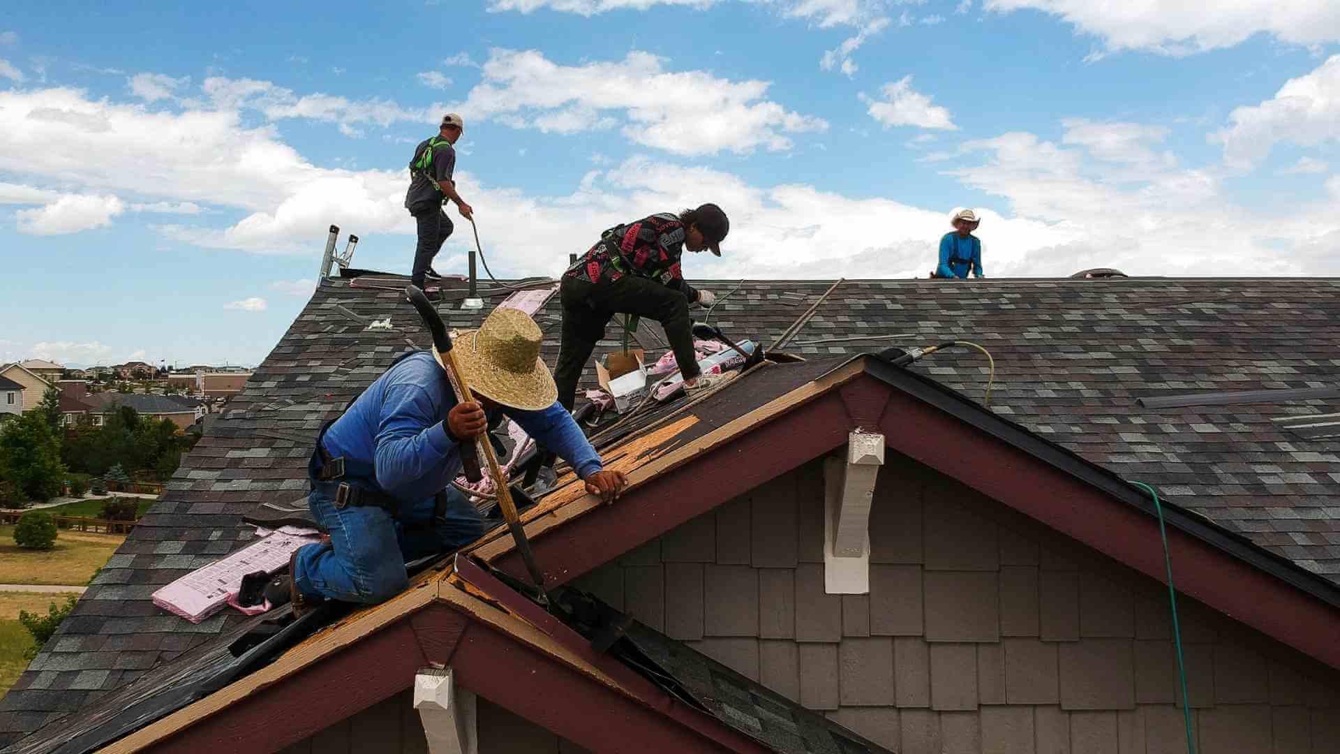 roofers pulling up asphalt roof