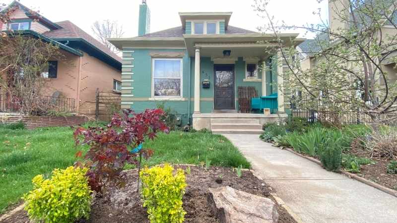 a mint green exterior of a denver home painted by kind home solutions
