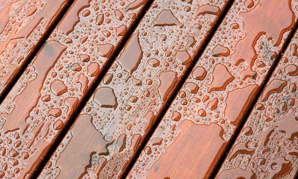 a photo of a deck with water pooling on it's surface