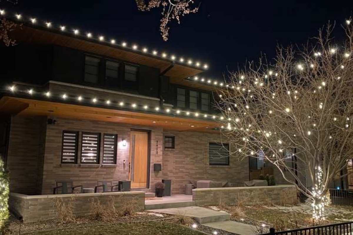 Photo of professional holiday lights on a roofline by kind home solutions
