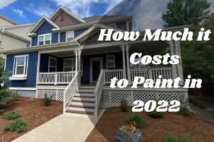 Photo of a home exterior painted by kind home solutions with title reading: how much it costs to paint in 2022