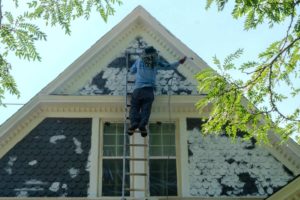 Photo of  a kind home painter painting a denver exterior