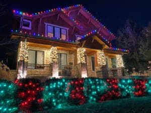 Photo of a home with professional holiday lights in multi-color bulbs