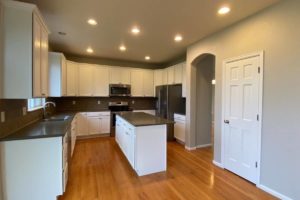 light gray painted kitchen walls with white cabinets