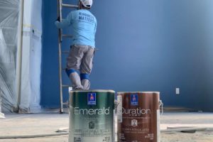 photo of interior painting with paint cans