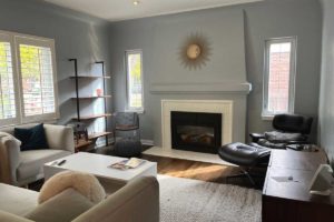 photo of interior living room painted by kind home solutions with gray blue walls