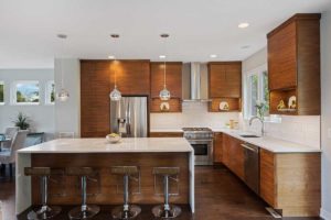 photo of kitchen with brown cabinets and neutral walls