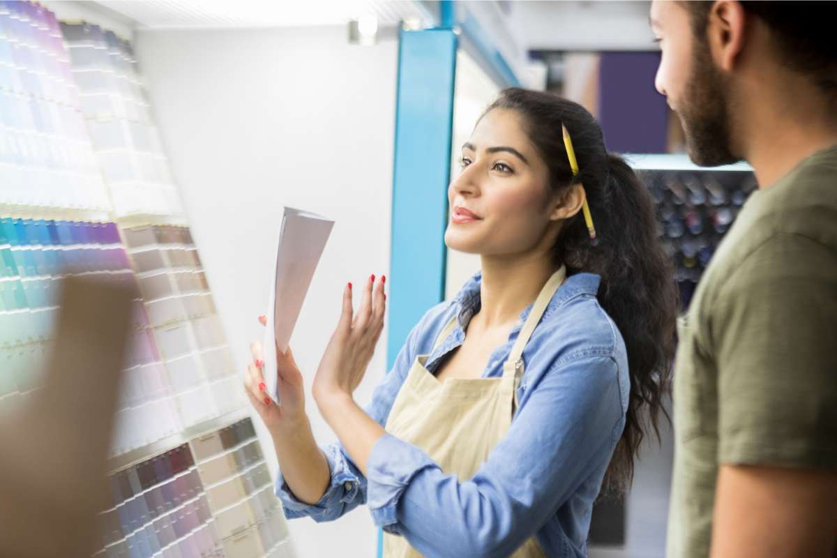 photo of a woman in a paint store matching paint colors