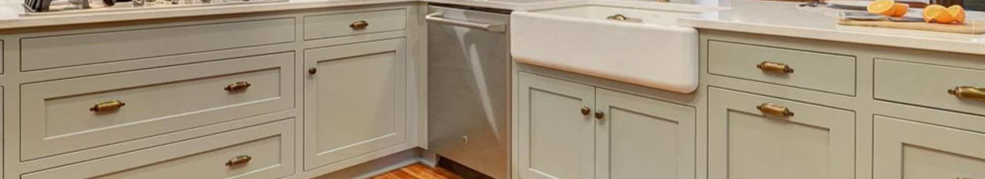 photo of sage green painted cabinets